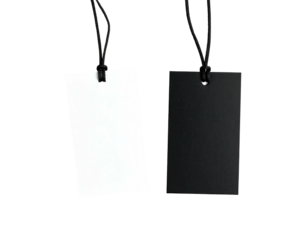Two blank rectangular tags, one white and one black, hang vertically on dark background, connected by black cord