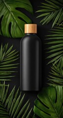 Black water bottle surrounded by lush green tropical leaves