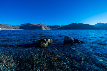 Beautiful rocky beach in Pangong Lake, the highest lake in the world, Ladakh, India.
