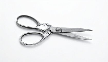 Open stainless steel scissors on white surface, showcasing sleek design and cutting precision.