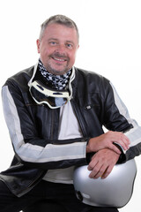portrait bearded handsome man in leather biker jacket motocross helmet and motorcycle goggles sitting on white background