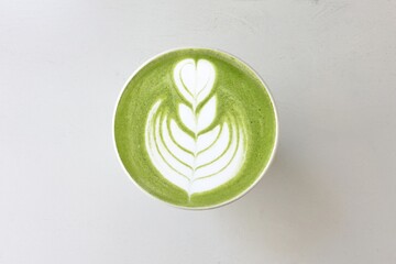   A cup of green tea matcha latte isolated on white background                                                                                                                                          