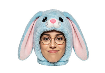 Isolated woman wearing a whimsical, fun, cute bunny hat with fluffy blue faux fur