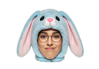 Isolated woman wearing a whimsical, fun, cute bunny hat with fluffy blue faux fur