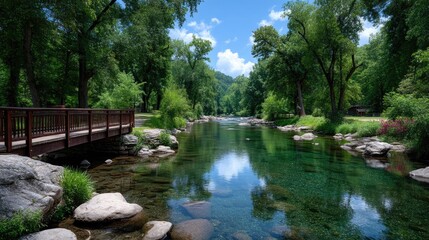 Long Wooden Bridge Over Tranquil River With Lush Green Trees and Blue Sky on a Sunny Day