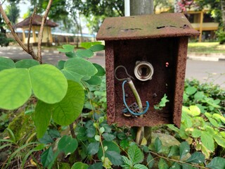 background of the electrical panel which is damaged and corroded