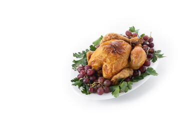 Roast turkey with grapes and parsley on white plate isolated on white background. Copy space
