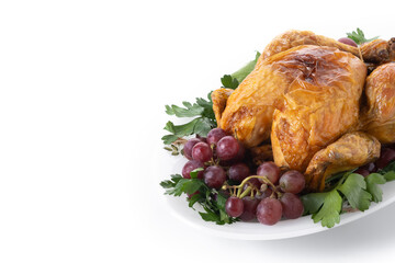 Roast turkey with grapes and parsley on white plate isolated on white background. Copy space