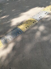background of black and yellow speed bumps