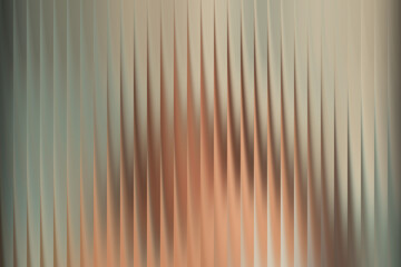 Abstract background with vertical pleats and soft gradient colors