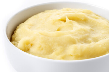 Mashed potatoes in white bowl isolated on white background. Close up