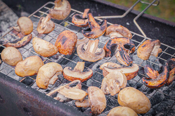 Grilled mushrooms sizzling on a barbecue during autumn, showcasing their rich flavors and textures