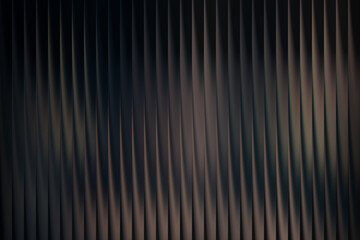 Abstract background with vertical dark metallic corrugated texture