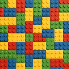 Seamless background pattern of colorful plastic toy construction bricks