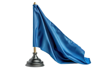 A vibrant blue flag gracefully droops on a metallic stand against a dark backdrop, evoking a sense of somber patriotism and remembrance.
