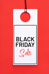 Black Friday Sale tag on red background