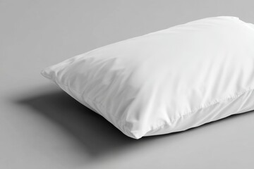 Soft and Fluffy White Pillow on a Light Gray Surface for Sleep Comfort