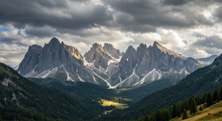 Fototapeta premium Dramatic mountain range with sharp peaks under a cloudy sky