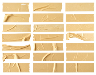 Beige adhesive tape strips on a surface, arranged in grid