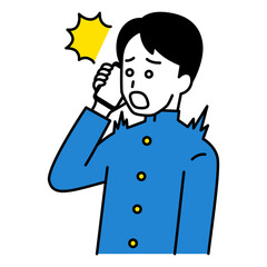 スマートフォンでの通話で驚く男子学生