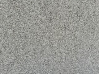 Horizontal dark gray old plaster wall background. Rough textured surface. Grungy architectural background close-up view, grey color wall material backdrop for design or copy space