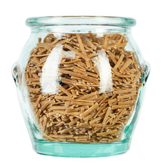 Glass jar filled raw pasta isolated on white background. File contains clipping path.