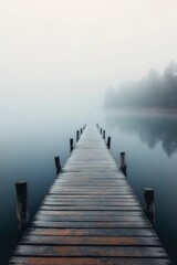 Serene Wooden Pier Extending Into a Misty Lake, Inviting Moments of Reflection and Contemplation