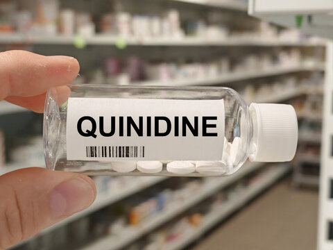 Box of QUINIDINE tablets on a hospital pharmacy table used to treat irregular heart rhythms an antiarrhythmic.