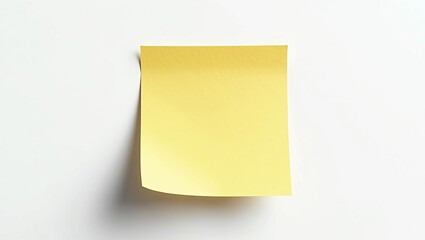 Fototapeta premium Yellow sticky note mockup on white background with shadow, minimalist office supply concept for reminders and organization