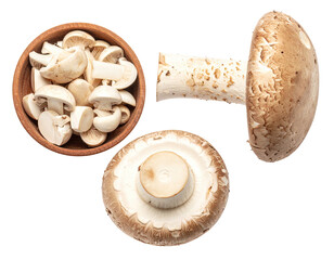 Fresh sliced mushrooms in a bowl, with whole mushrooms, overhead view