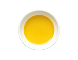 Creamy, bright yellow liquid in a small, white bowl