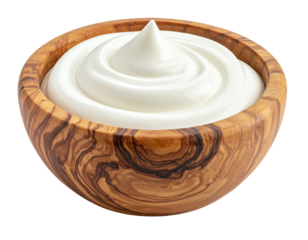 Creamy white sauce swirls in a shallow wooden bowl