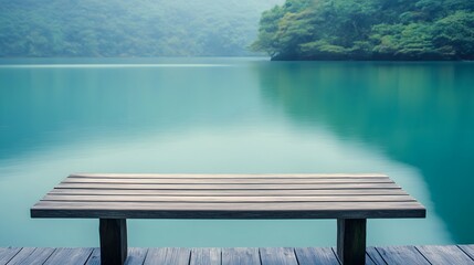 Tranquil wooden dock bench overlooking a serene turquoise lake, bathed in soft morning light.