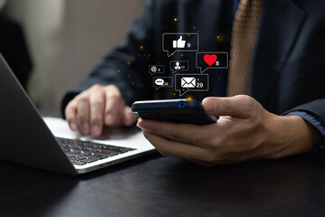 hands of woman using smart phone with notification icons of love, like, message, comment, email, address, shopping and star above smartphone screen, Social, media, Marketing concept.