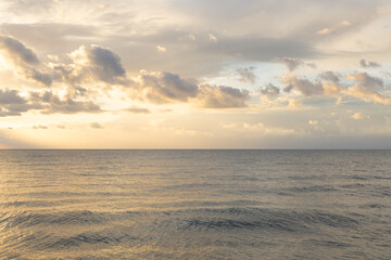 minimalist seascape in calm soft pastel colors. calm sea water surface under scenic sunset sky. horizon under water. aesthetic artistic