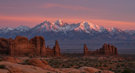 Sunrise over mountains and red rock formations