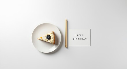Minimalist overhead shot of a birthday cake slice with a berry, a golden candle, and a 'Happy Birthday' card on a clean white background.