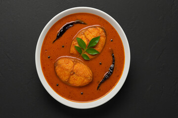 Goa Food - Indian Traditional Goan Pomfret or butter fish curry. Hot and spicy homemade fish gravy cooked using coconut milk and Indian spices.