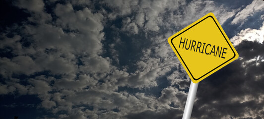 danger,caution,Hurricane Idalia warning sign against a powerful stormy background with copy space. Dirty and angled sign with cyclonic winds add to the drama.hurricane season sign on cloudy background