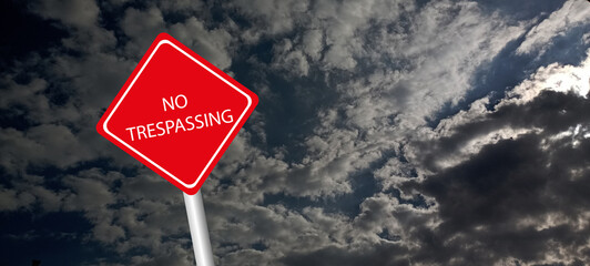 No trespassing attention sign on background 