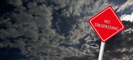 No trespassing attention sign on background 