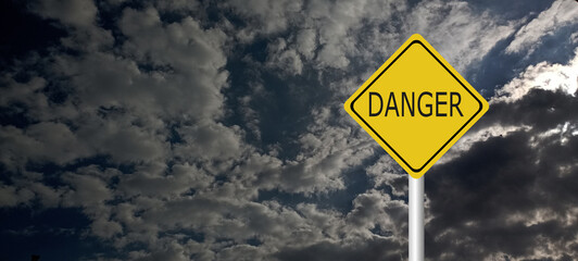 danger,caution,Hurricane Idalia warning sign against a powerful stormy background with copy space. Dirty and angled sign with cyclonic winds add to the drama.hurricane season sign on cloudy background