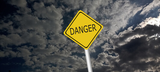 danger,caution,Hurricane Idalia warning sign against a powerful stormy background with copy space. Dirty and angled sign with cyclonic winds add to the drama.hurricane season sign on cloudy background