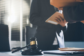 Lawyer explained to the client about the law that must be brought against the court case.