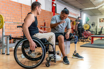 People with disabilities talking and laughing in gym