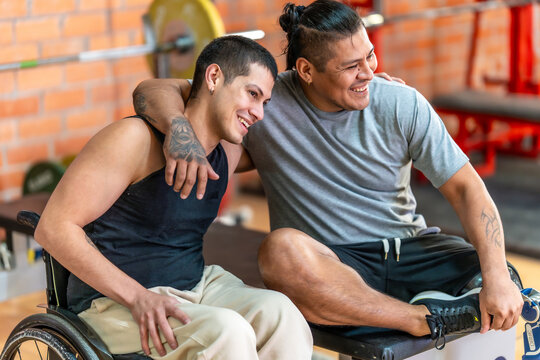 Diverse men friends embracing at a gym
