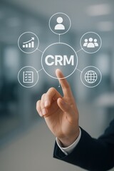 Fototapeta premium Hand Pointing at CRM Concept with Icons Representing Business and Customer Relationship Management