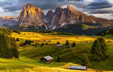 The UNESCO site Seiser Alm or Alpe di Siusi the Dolomite plateau and the largest high-elevation Alpine meadow  in Europe located in Italy's South Tyrol province in the Dolomites in autumn sunset.