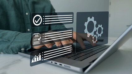 Automated industrial technology with digital transformation.Engineer setting up automated software.Business process optimisation.Robotic process automation or RPA.	