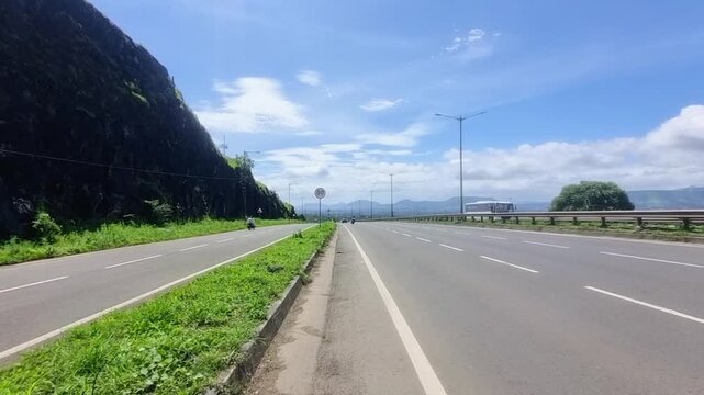 A section of the Pune-Bangalore Highway, which is indeed a significant part of National Highway 48 (NH 48), traversing through the scenic Western Ghats